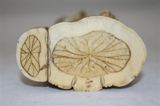 A Japanese walrus ivory figure of a man pouring water from a gourd, early 20th century, height 21cm